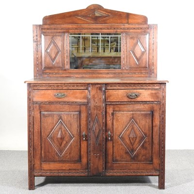 Lot 214 - An early 20th century oak mirror back sideboard