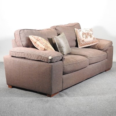 Lot 487 - A modern brown upholstered sofa, with loose...