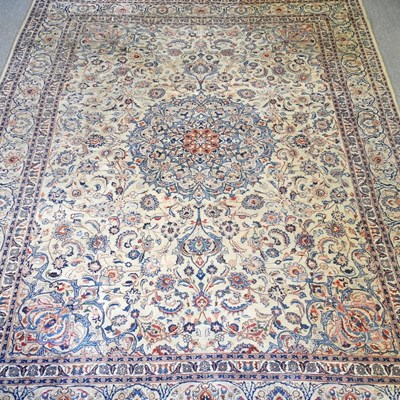 Lot 533 - A large Persian woollen carpet, with all over...