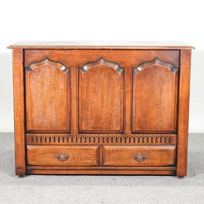 Lot 447 - An 18th century style panelled oak mule chest,...