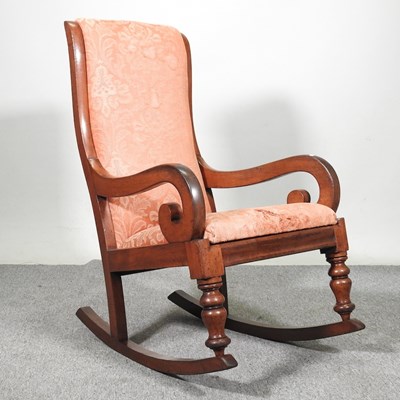Lot 522 - A Victorian walnut rocking chair, with an...
