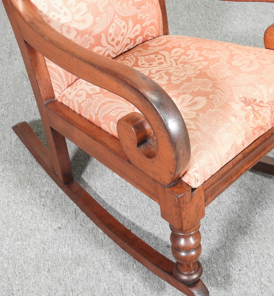 Lot 522 - A Victorian walnut rocking chair, with an