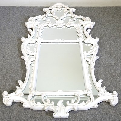 Lot 266 - A large and ornate wall mirror, the marginal...