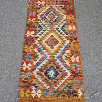 Lot 282 - A kilim runner, with three central diamonds,...