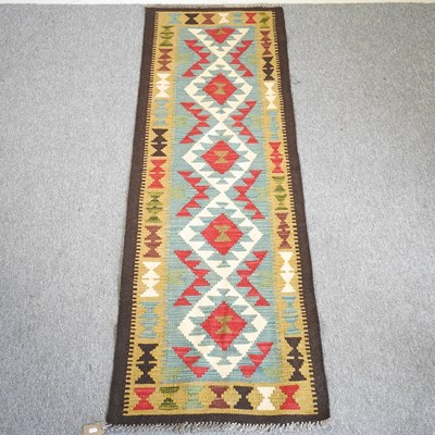 Lot 502 - A kilim runner, with a central row of diamonds,...