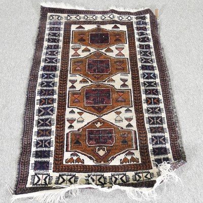 Lot 125 - A small Turkish rug, with a row of four...