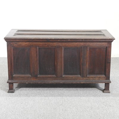 Lot 460 - An antique oak coffer, with a hinged lid