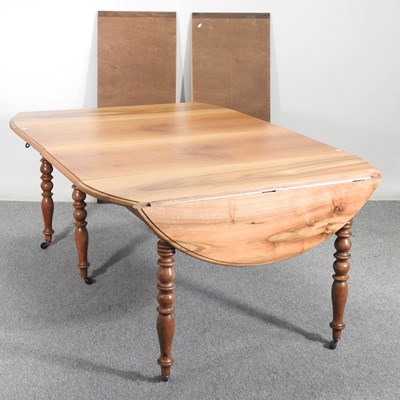 Lot 284 - A continental hardwood pull out extending drop...