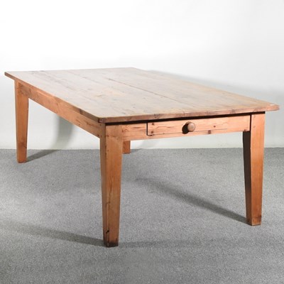 Lot 170 - A large pine dining table, with a plank top,...