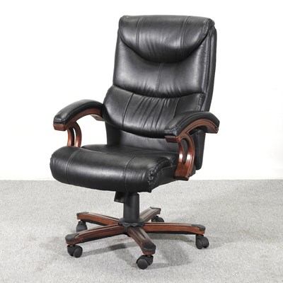 Lot 229 - A black leather revolving desk chair