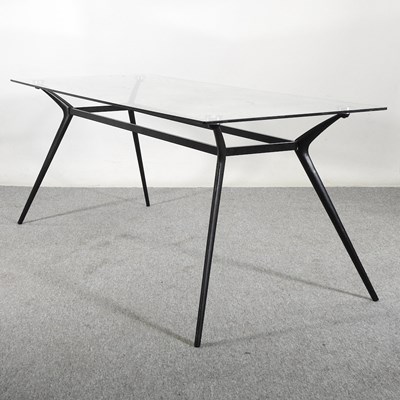 Lot 504 - A contemporary dining table, with a glass top,...