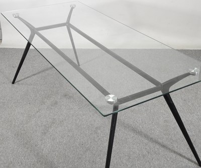 Lot 504 - A contemporary dining table, with a glass top,...