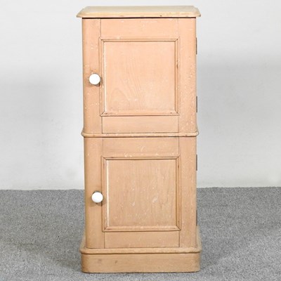 Lot 438 - A Victorian stripped pine bedside cabinet