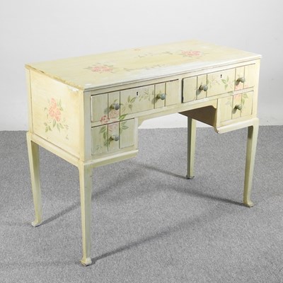 Lot 241 - A painted dressing table, with floral decoration