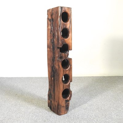 Lot 404 - A rustic wooden wine rack, 96cm tall, to hold...