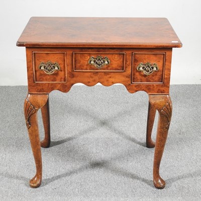 Lot 466 - A Queen Anne style burr walnut lowboy, 20th...