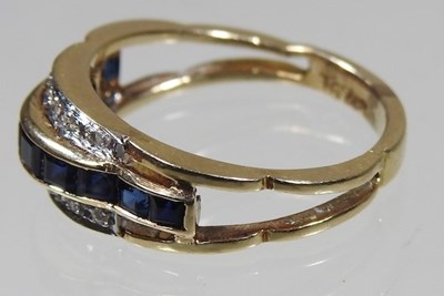 Lot 20 - A 14 carat gold sapphire and diamond channel...