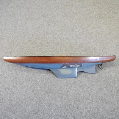 Lot 452 - A large painted wooden pond yacht, 124cm long