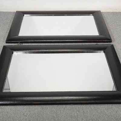 Lot 312 - A pair of Chinese ebonised framed wall mirrors,...