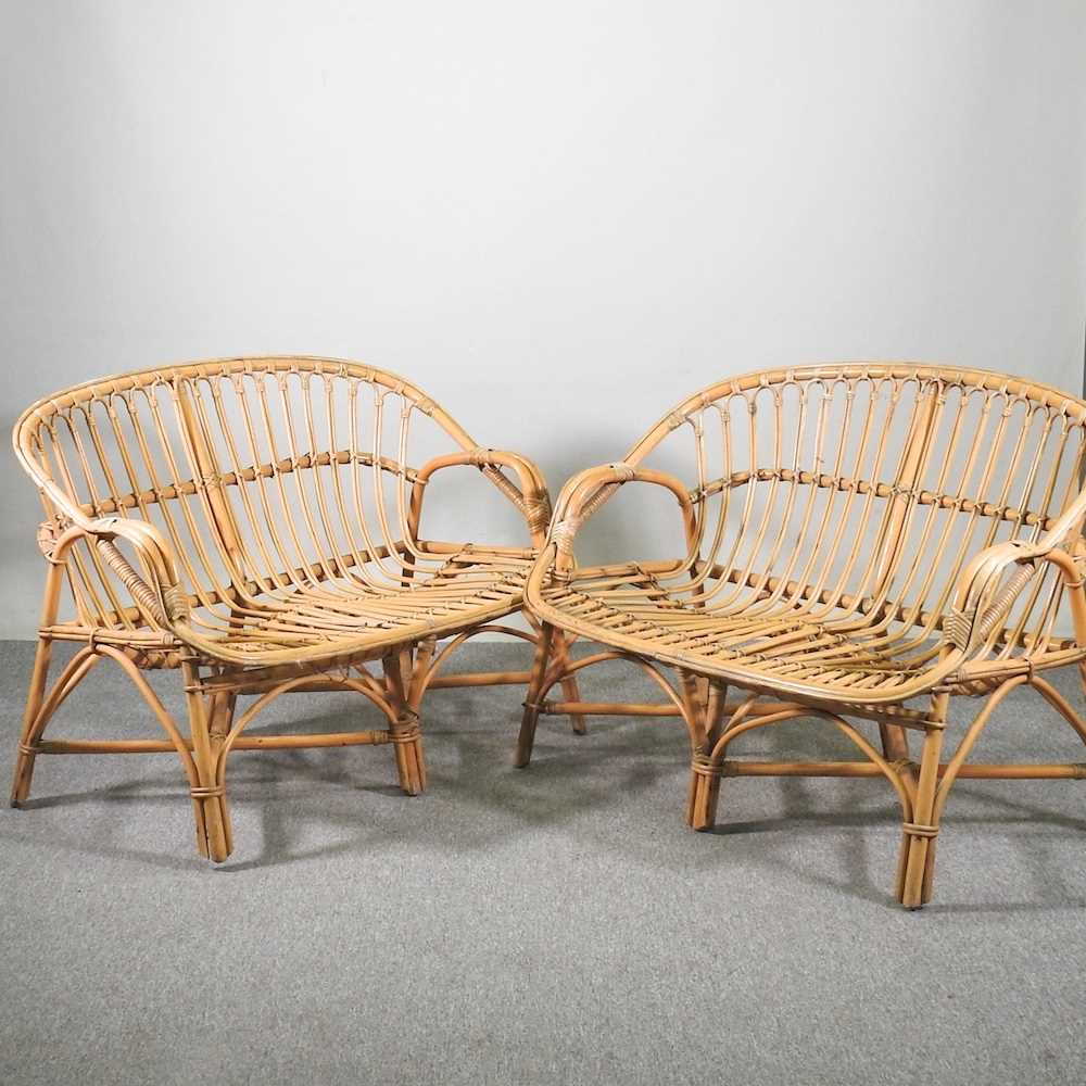 Lot 219 - A pair of bamboo two seater sofas (2)