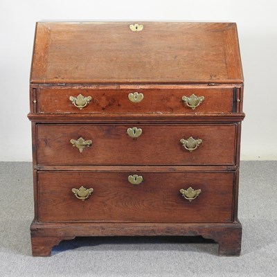 Lot 156 - An early 18th century oak bureau, with a...