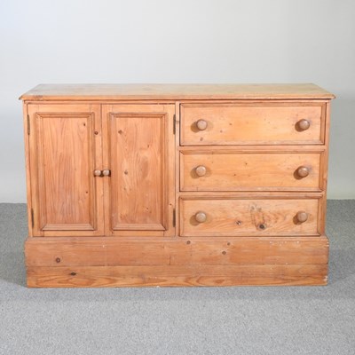 Lot 250 - An antique pine side cabinet, on a plinth base