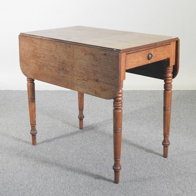 Lot 459 - A Regency oak pembroke table, on turned legs