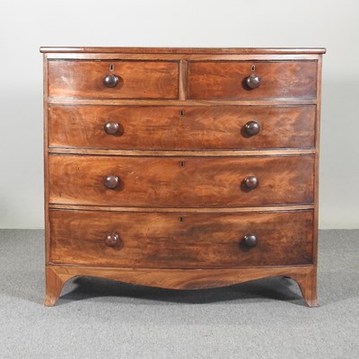 Lot 190 - A Victorian mahogany bow front chest, on swept...
