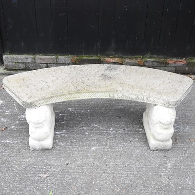 Lot 19 - A cast stone curved garden bench