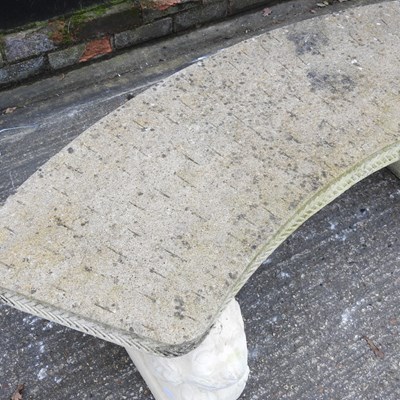 Lot 19 - A cast stone curved garden bench