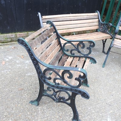 Lot 274 - A wooden garden bench, with green painted...