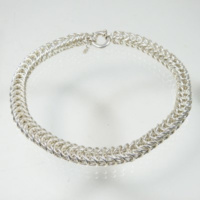 Lot 154 - A heavy silver flexible link necklace, 134g,...