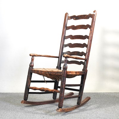 Lot 294 - A 19th century elm and ash ladderback rocking...