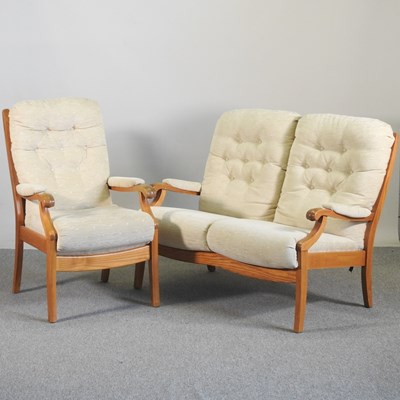 Lot 333 - A Cintique cream upholstered two seater sofa,...