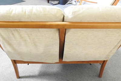 Lot 333 - A Cintique cream upholstered two seater sofa,...