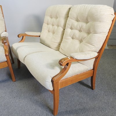 Lot 333 - A Cintique cream upholstered two seater sofa,...