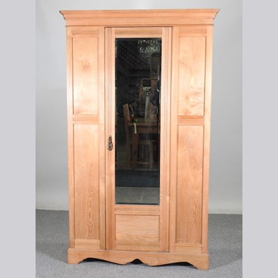 Lot 108 - An Edwardian light ash single wardrobe, with a...