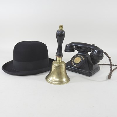 Lot 126 - A vintage black bakelite telephone, together...