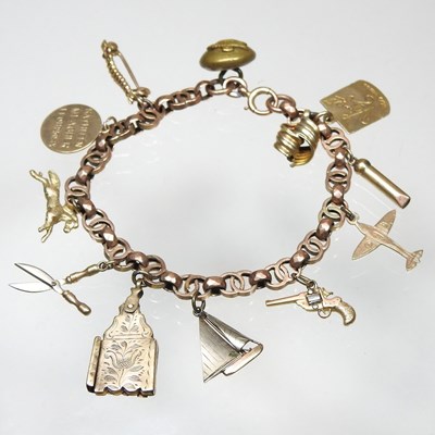 Lot 121 - An early 20th century charm bracelet,...