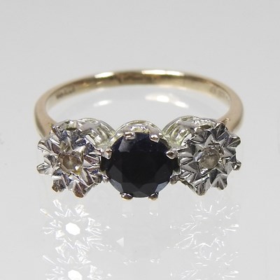 Lot 184 - A 9 carat gold sapphire and diamond ring, the...