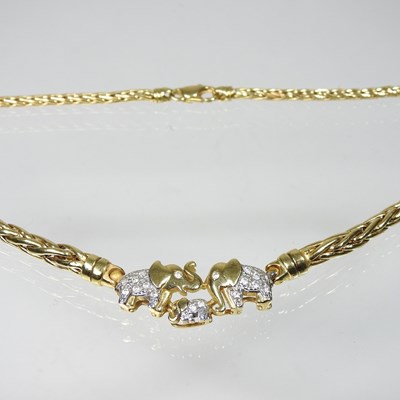 Lot 305 - A fancy link necklace, suspended with three...