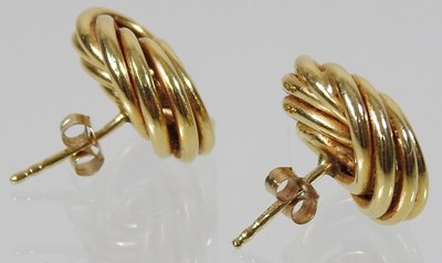 Lot 174 - A pair of 18 carat gold earrings