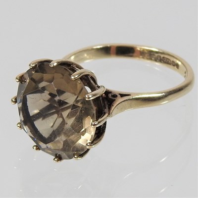 Lot 71 - A 9 carat gold smoky quartz single stone ring