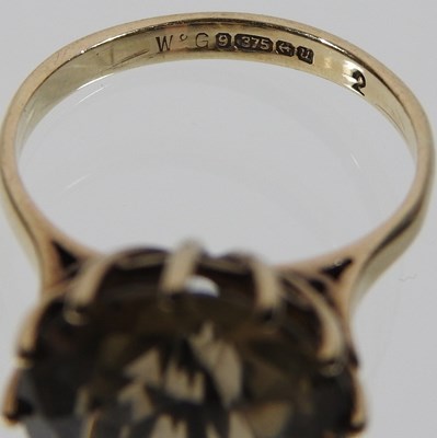 Lot 71 - A 9 carat gold smoky quartz single stone ring