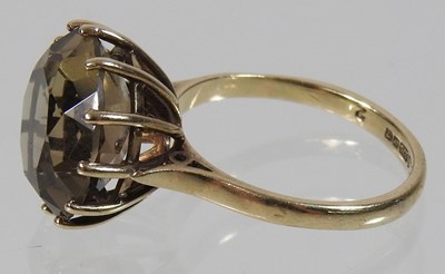 Lot 71 - A 9 carat gold smoky quartz single stone ring