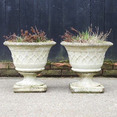 Lot 97 - A pair of cast stone garden urns, of pedestal...