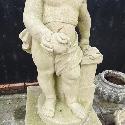 Lot 1 - A cast stone garden statue figure of a cherub,...