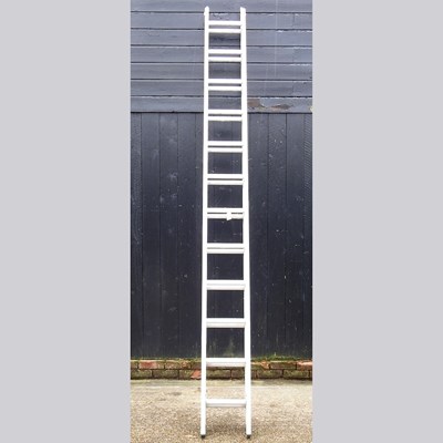 Lot 257 - An aluminium extending ladder in two sections,...