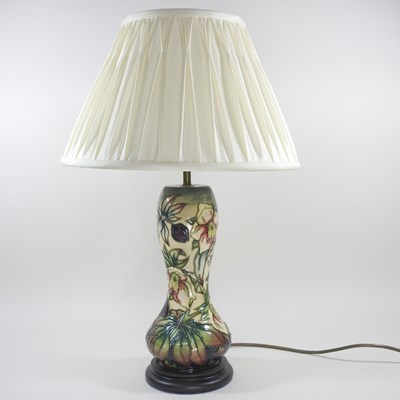 Lot 395 - A Moorcroft pottery table lamp, decorated in...