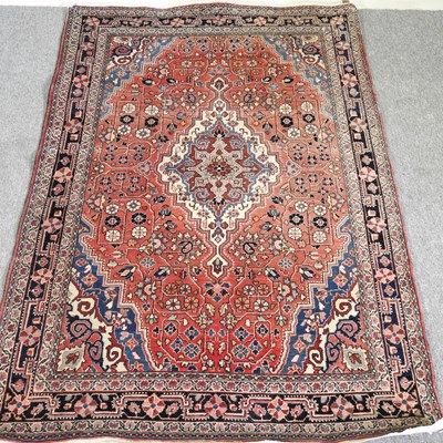 Lot 279 - A Persian rug, with a large central medallion...